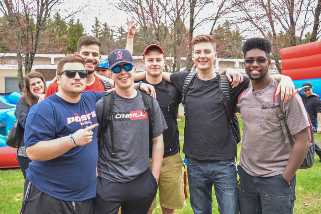 Six young men enjoying Spring Fling, an annual fun event put on by Student Senate