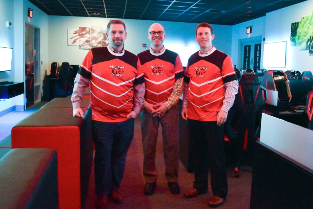 Carbonite officials donned official jerseys for this photo taken in the Esports Arena at CMCC. Left to right are Rob Frost, vice president of customer care; Brett Siedman, senior director of customer care; and Tom Neal, senior manager of recruiting.