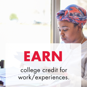 Black woman in a nursing uniform and a colorful head wrap studies for an upcoming exam. Text overlay says "Earn college credit for work/experiences."