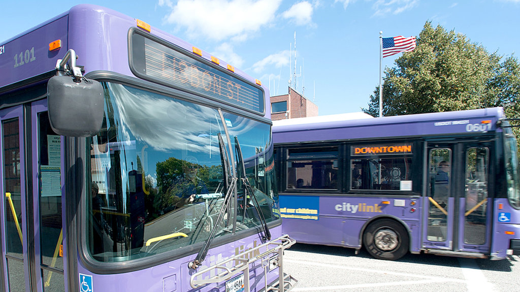 A pair of Citylink buses depart from the bus station